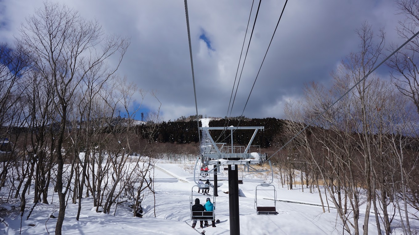 Mineyama Kogen in Japan - a ski lift going up a snowy slope.