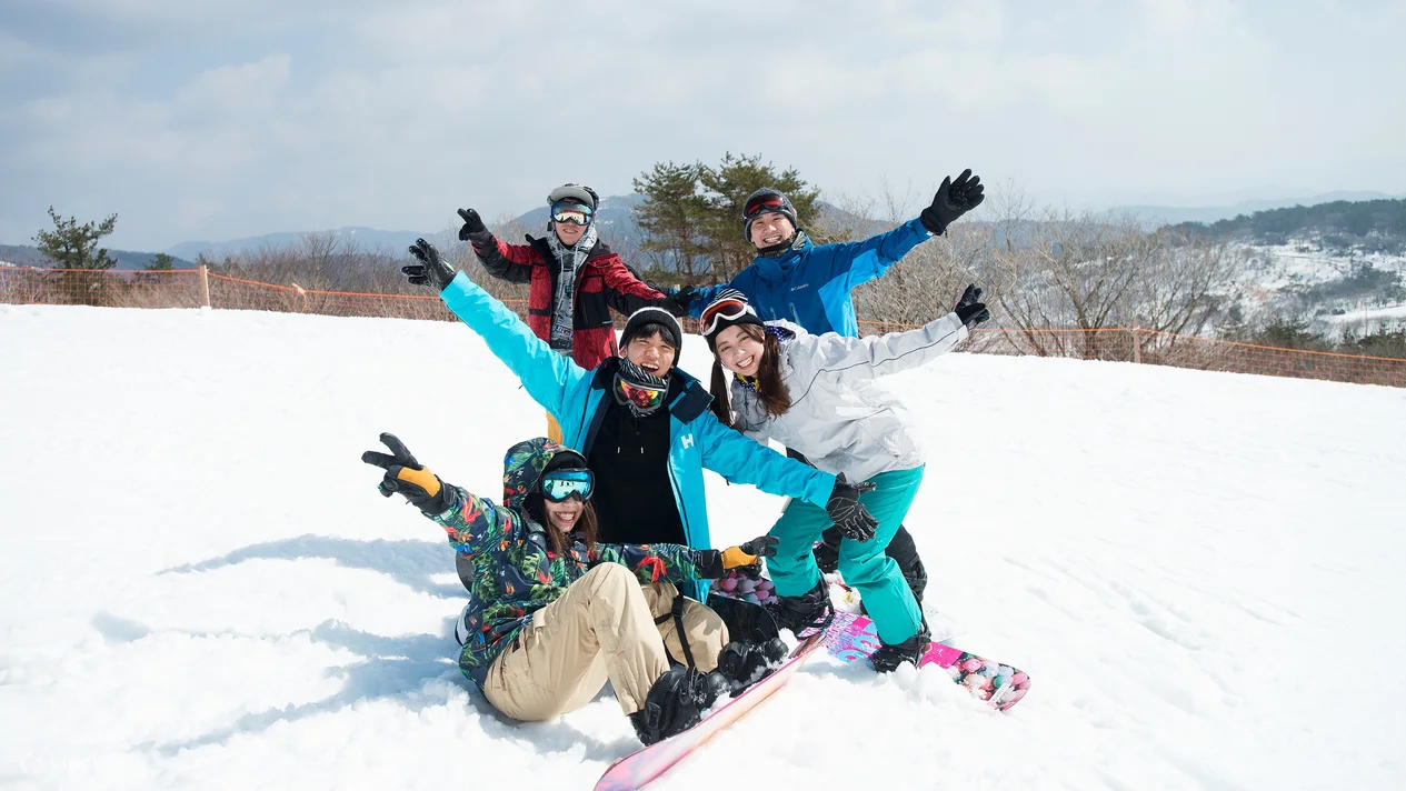 Mineyama Kogen in Japan - a group of people sitting in the snow.