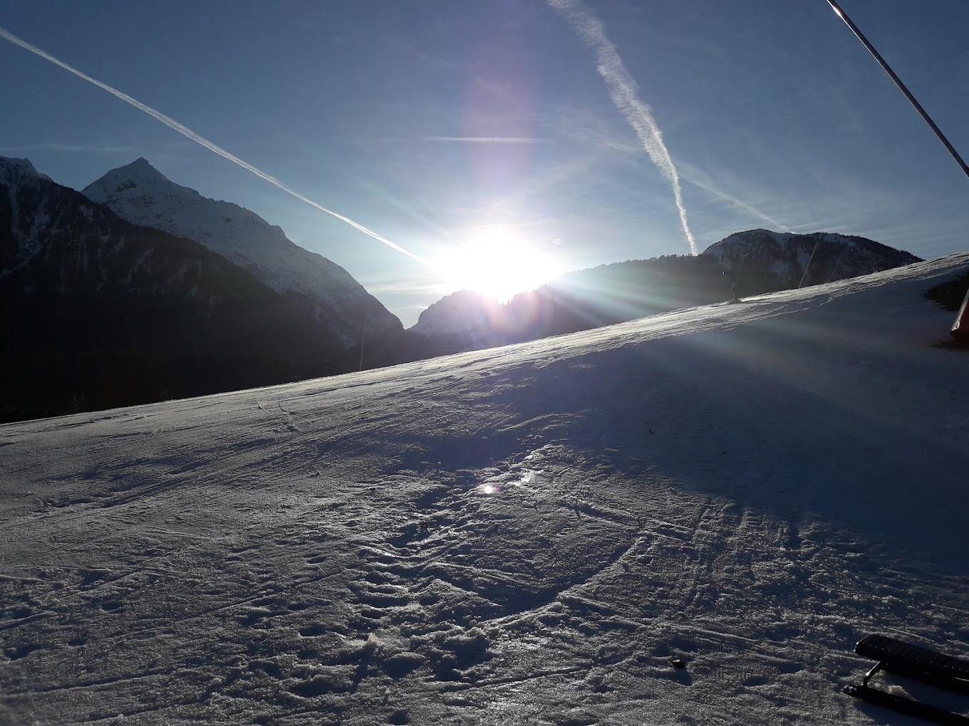 Kötschach-Mauthen in Austria - a person is skiing down a snowy slope.