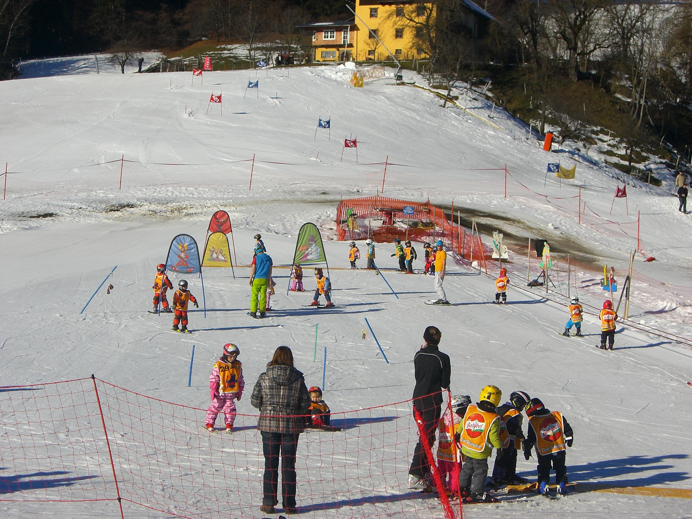 Kötschach-Mauthen in Austria - a group of people standing on a snow covered slope.