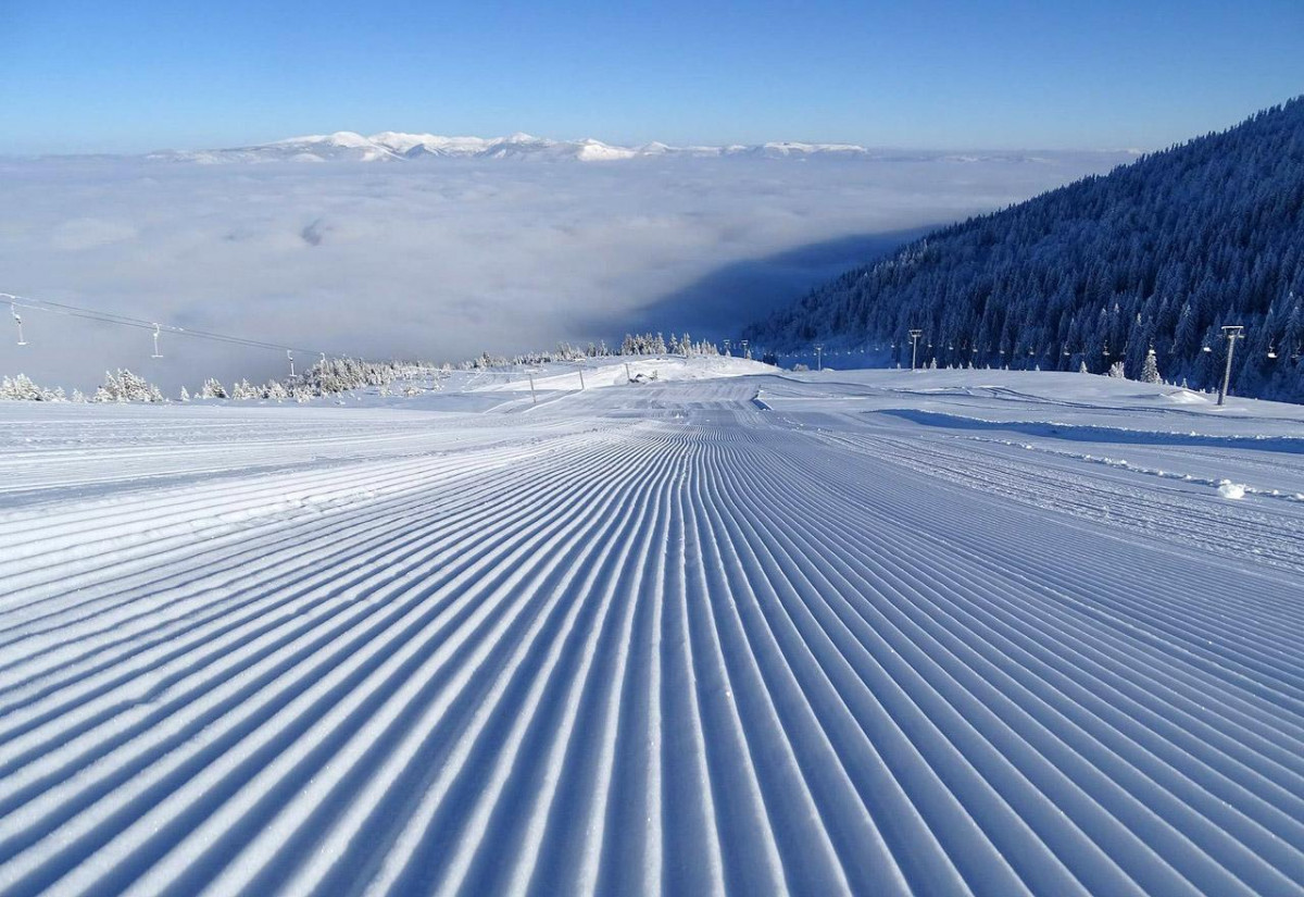 Radusa in Bosnia and Herzegovina - a ski slope covered in snow with mountains in the background.
