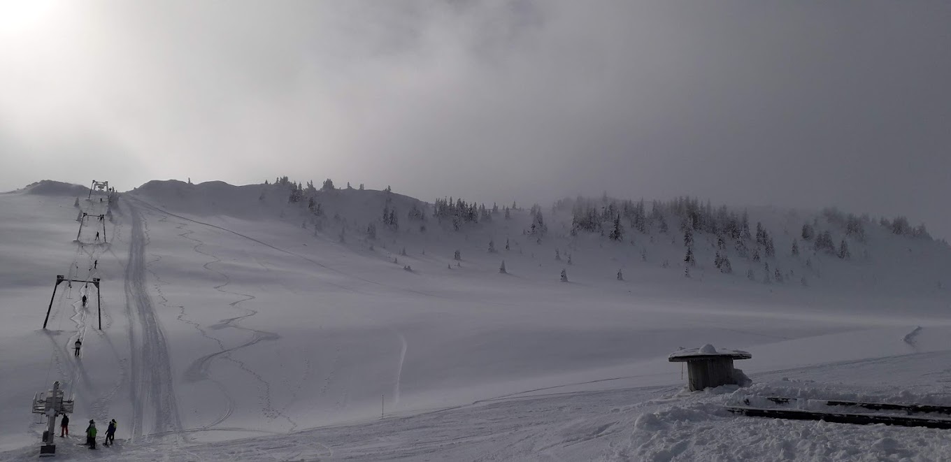Radusa in Bosnia and Herzegovina - a ski slope with people skiing down it.