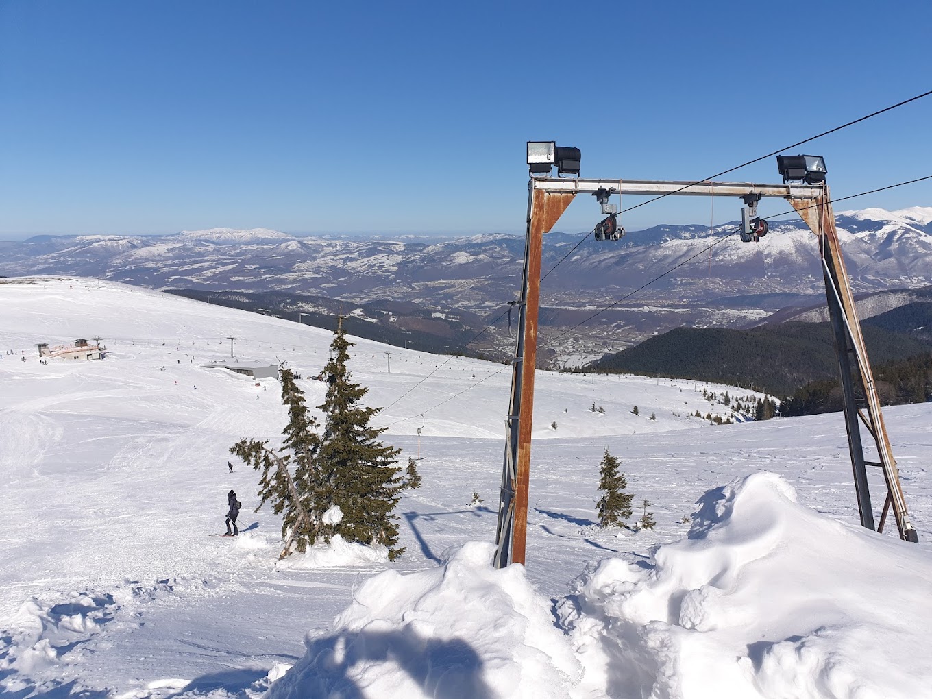 Radusa in Bosnia and Herzegovina - a ski lift going up a snowy slope.