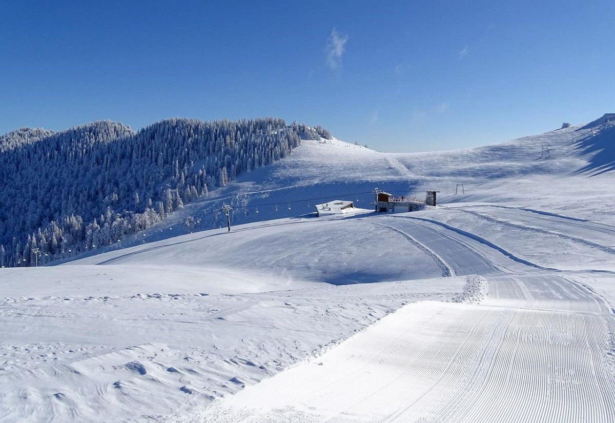 Radusa in Bosnia and Herzegovina - a snow covered ski slope with trees in the background.