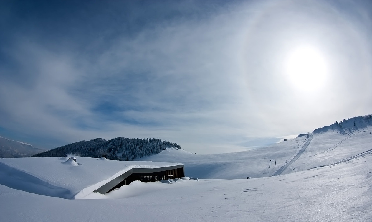 Radusa in Bosnia and Herzegovina - the sun is shining over the snow covered mountains.