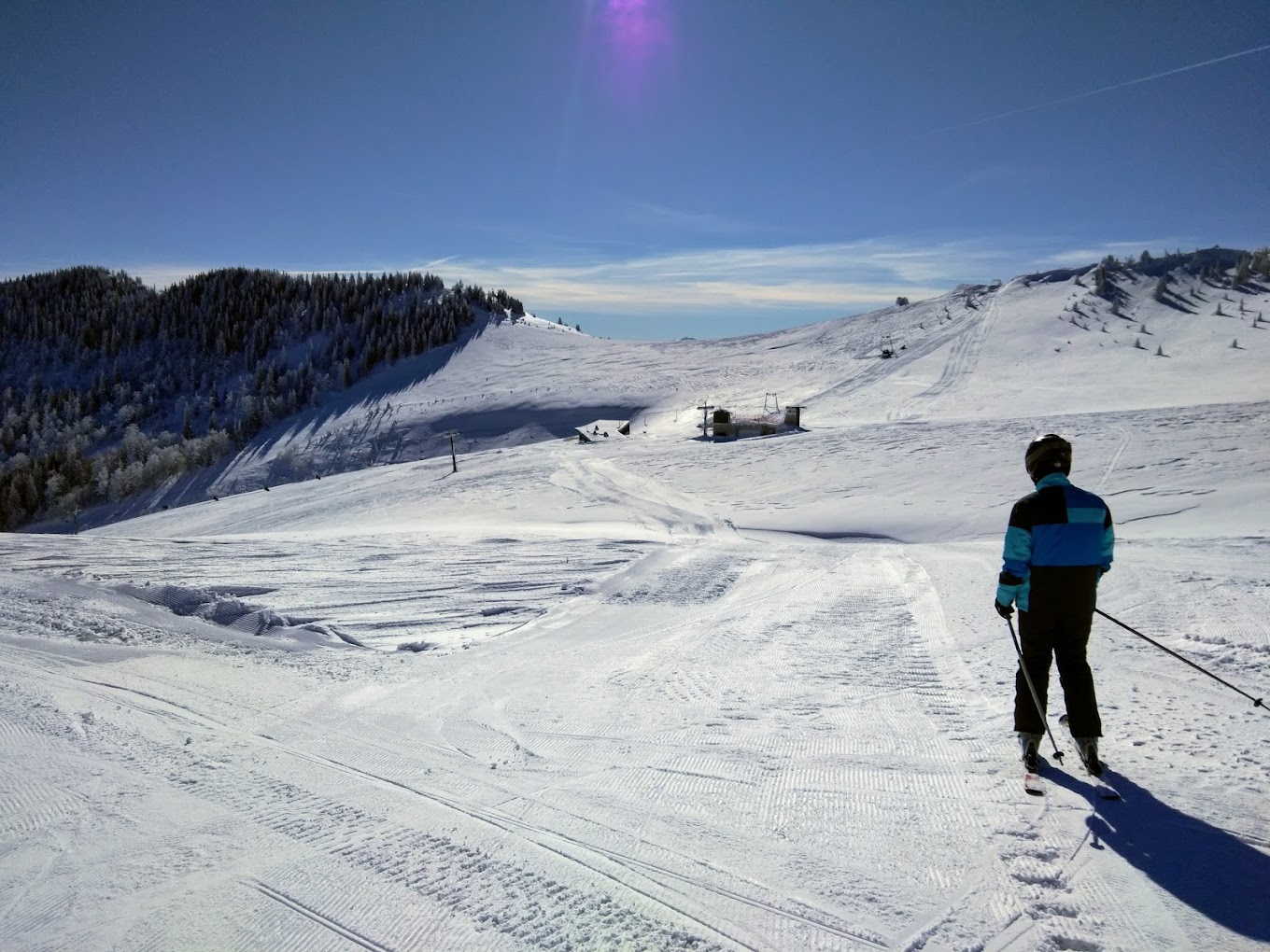 Radusa in Bosnia and Herzegovina - a person skiing down a snow covered slope.