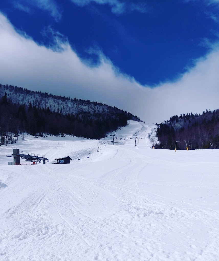 Radusa in Bosnia and Herzegovina - a snow covered ski slope with trees in the background.