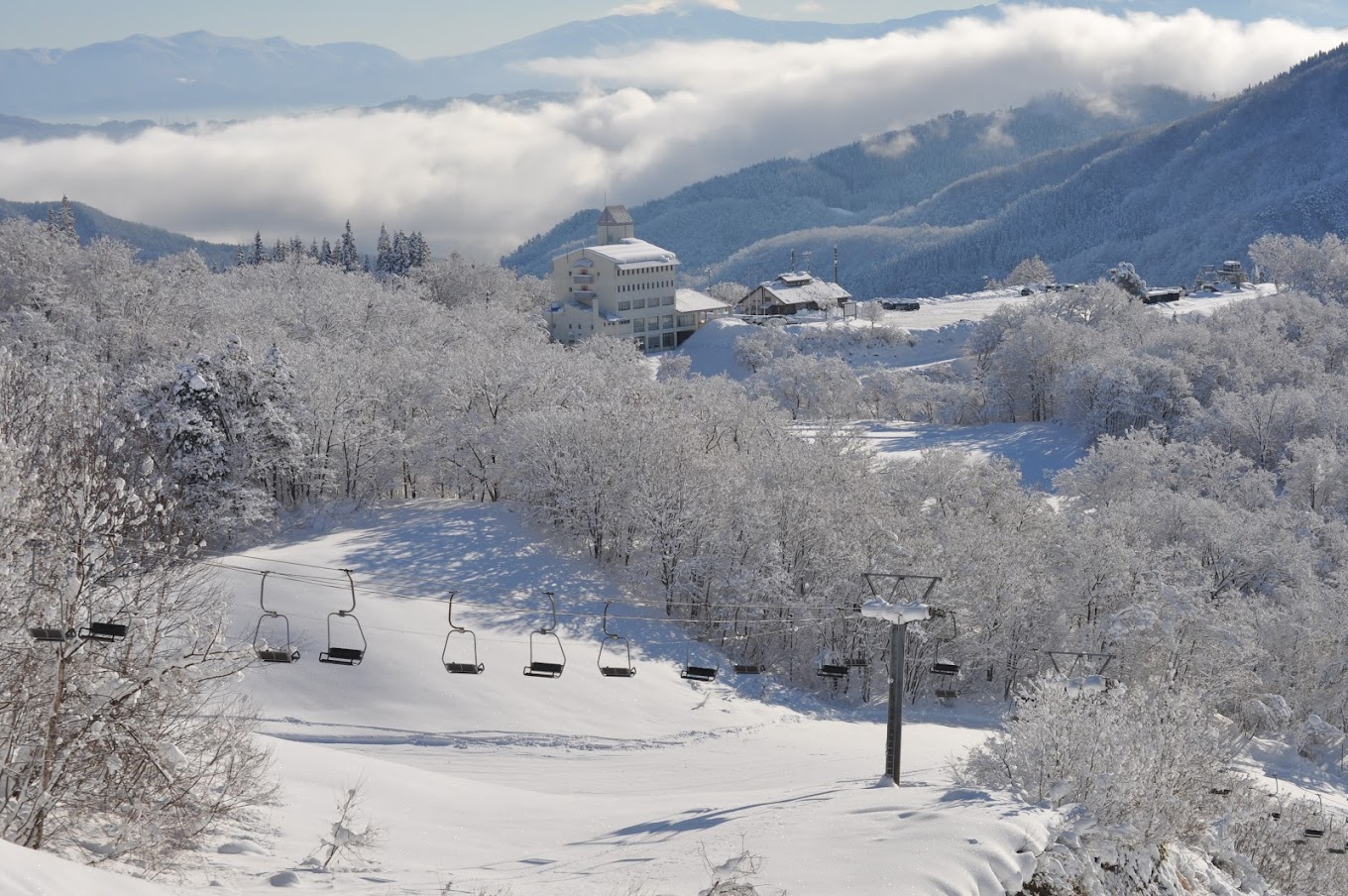 Asahi Shizen in Japan - a snow covered ski slope in the mountains.