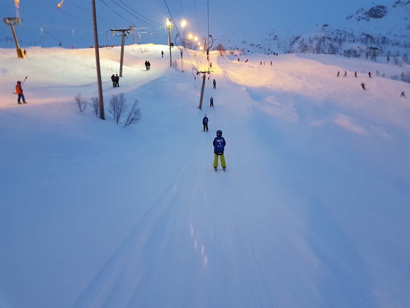 Eikedalen in Norway - a group of people skiing down a snowy slope.