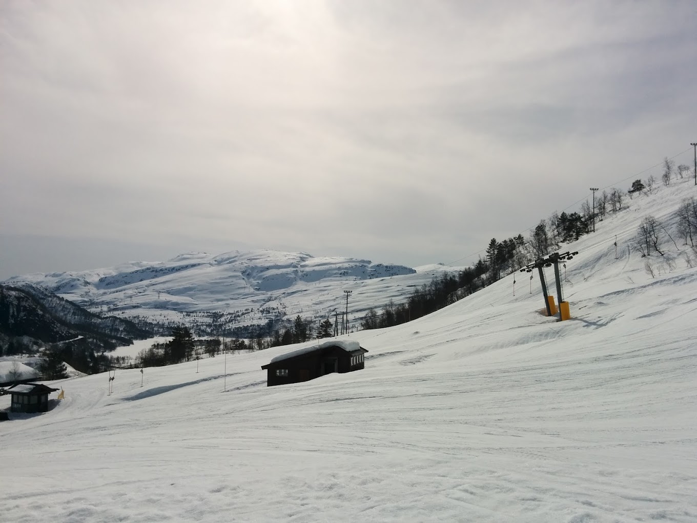 Eikedalen in Norway - a snow covered ski slope with mountains in the background.