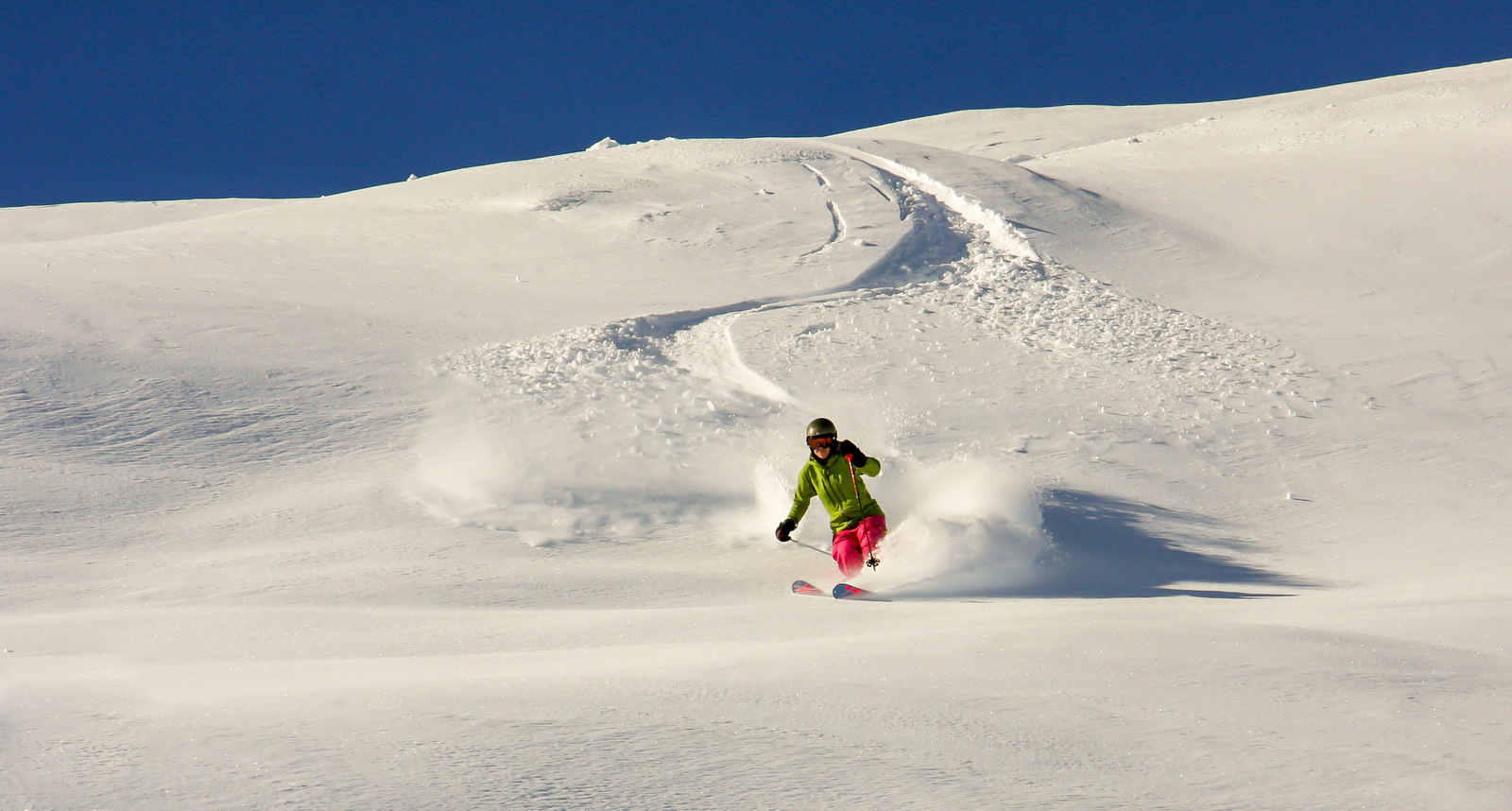 Eikedalen in Norway - a person riding a snowboard down a snowy slope.