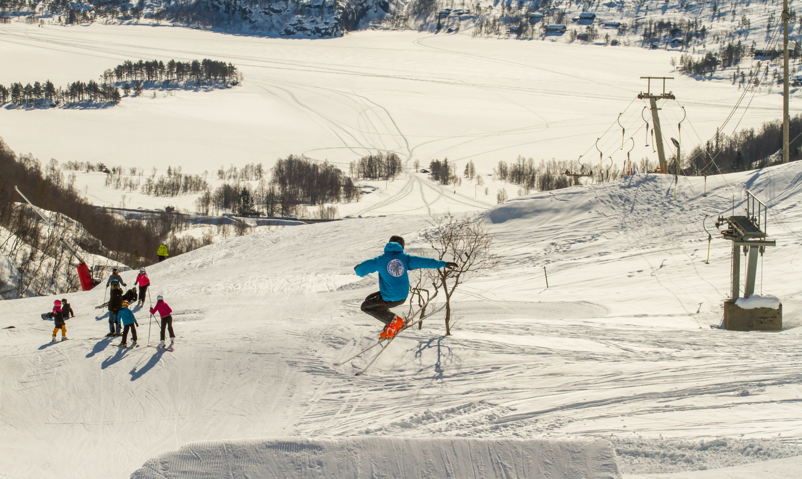 Eikedalen in Norway - a group of people skiing down a mountain.