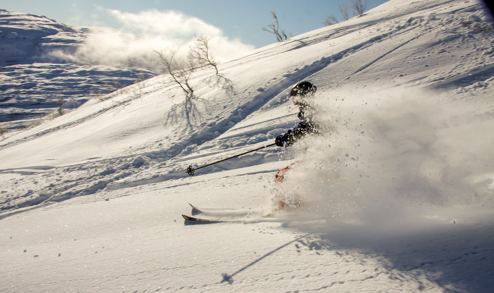 Eikedalen in Norway - a person is skiing down a snowy hill.