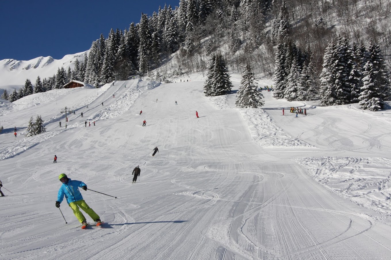 Cordon in France - a group of people skiing down a snowy slope.