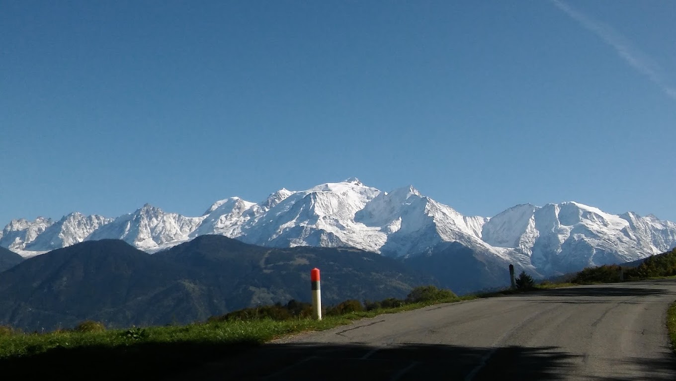 Cordon in France - a road with snow capped mountains in the background.
