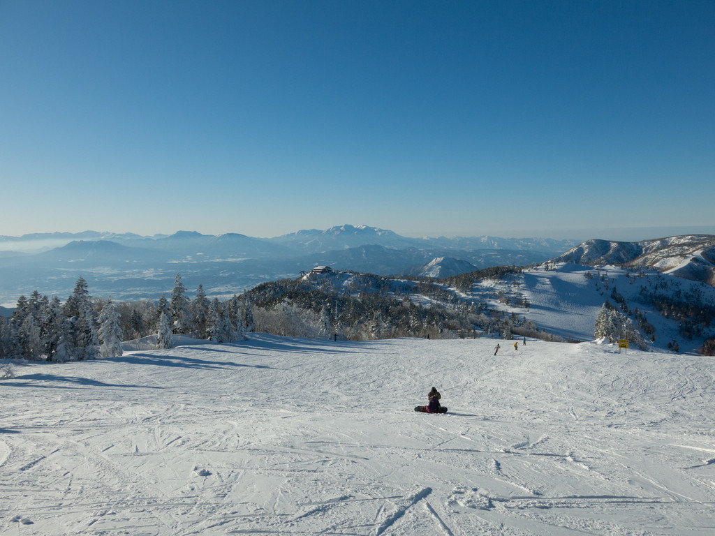 Shiga Kogen Terakoya in Japan - a person standing on top of a snow covered mountain.