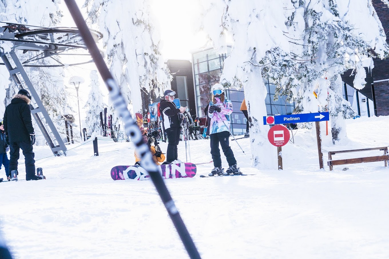 Koli Ski - Ukko-Kolin rinteet in Finland - a group of people that are standing in the snow.