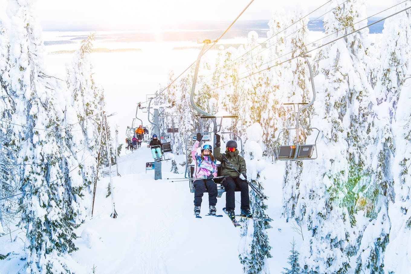 Koli Ski - Ukko-Kolin rinteet in Finland - a group of people riding a ski lift.