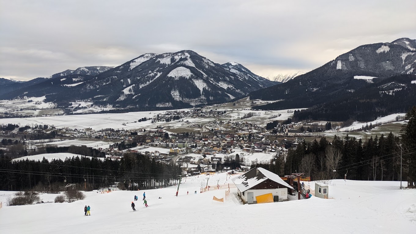 Schwabenbergarena Turnauer Schilift in Austria - a group of people skiing down a snow covered slope.
