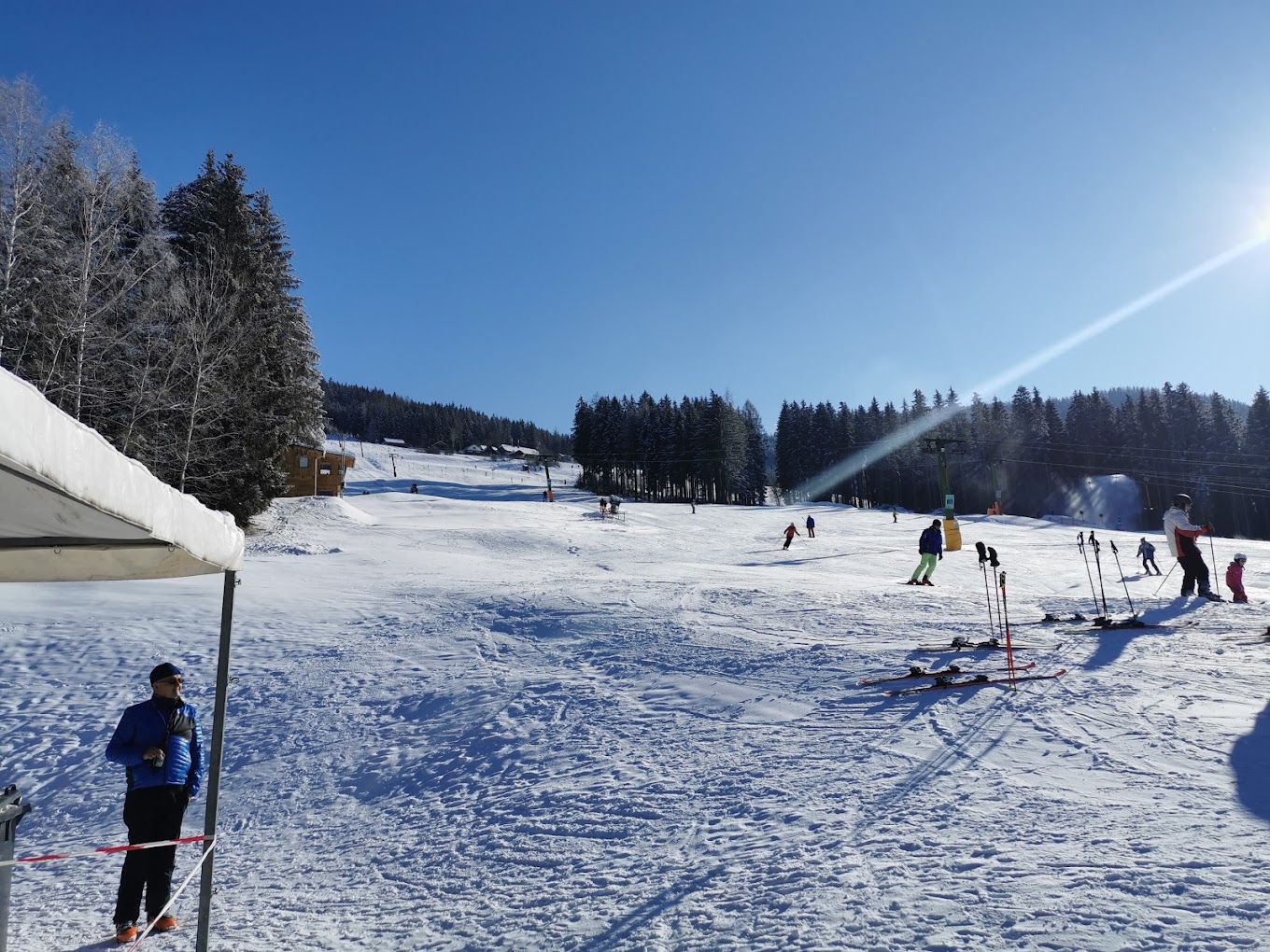 Schwabenbergarena Turnauer Schilift in Austria - a group of people skiing down a snowy slope.