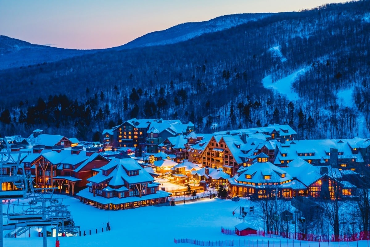 Stowe in USA: a ski resort in the mountains at night.