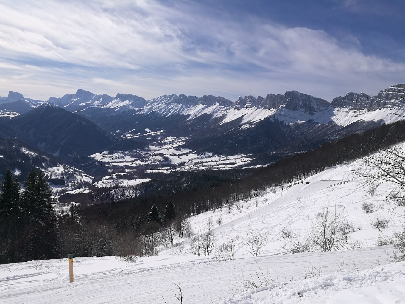 Col de l'Arzelier in France - a view from the top of a snowy mountain.
