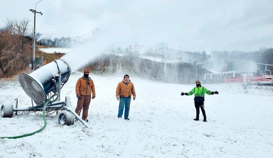 Font d'Urle in France - two people standing in the snow with a snow blower.