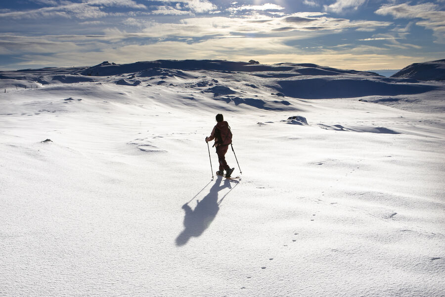 Font d'Urle in France - a person skiing down a snow covered mountain.