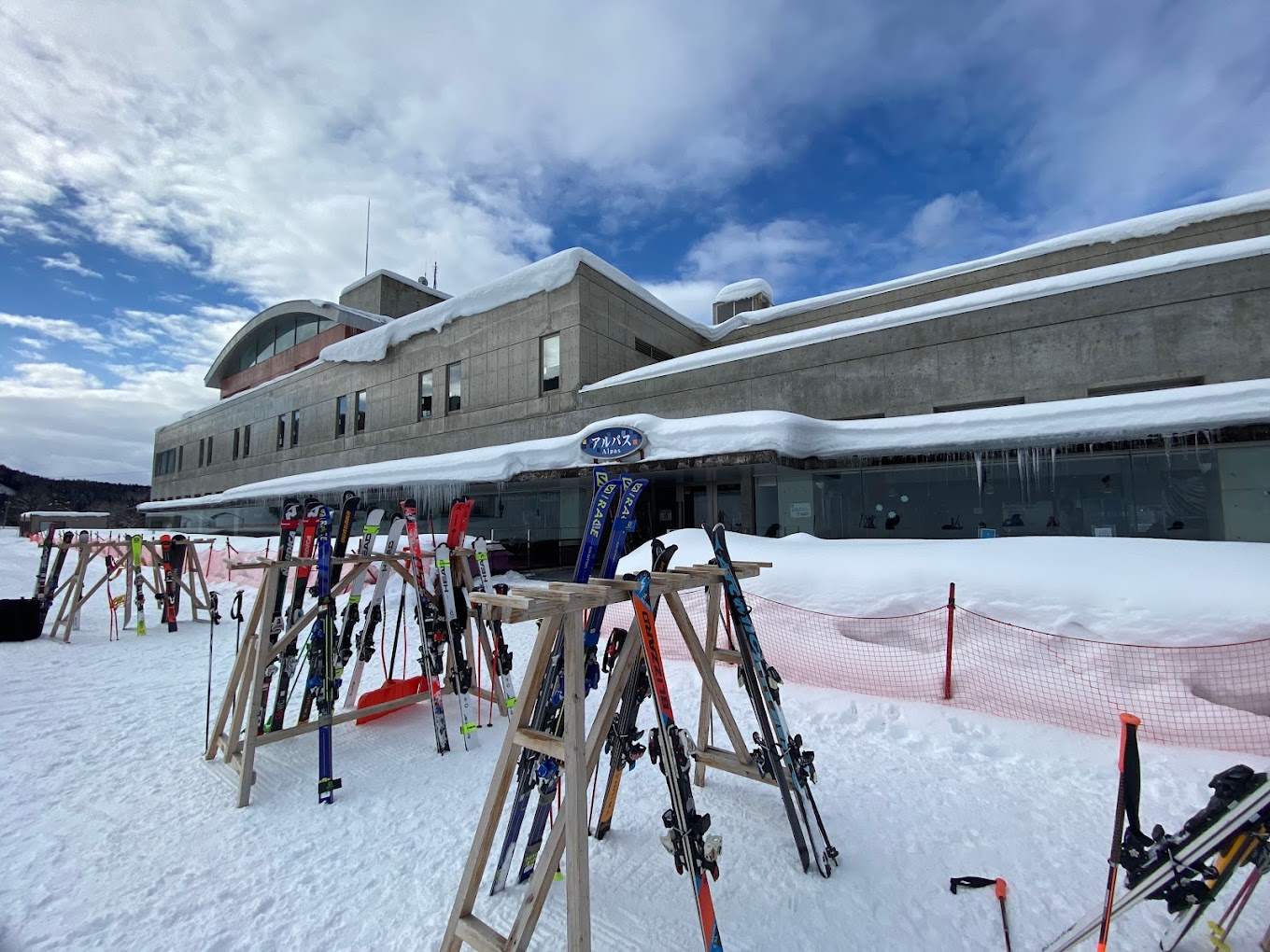 Hanawa in Japan - a bunch of skis and poles in the snow.