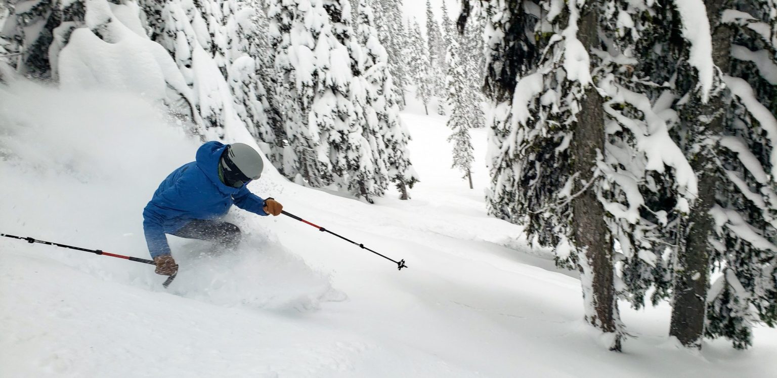 Mission Ridge in Canada - a person skiing down a mountain covered in snow.