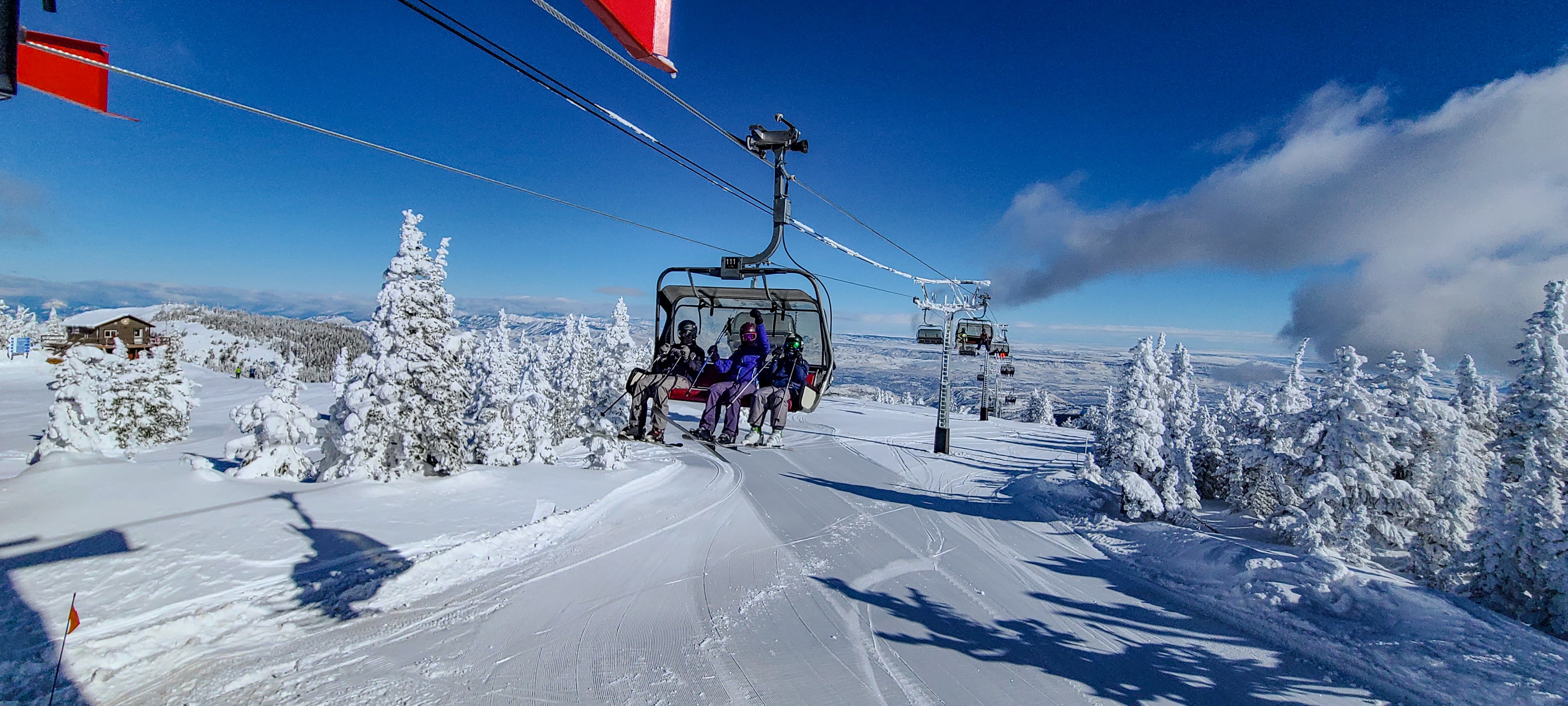Mission Ridge in Canada - a group of people riding a ski lift.
