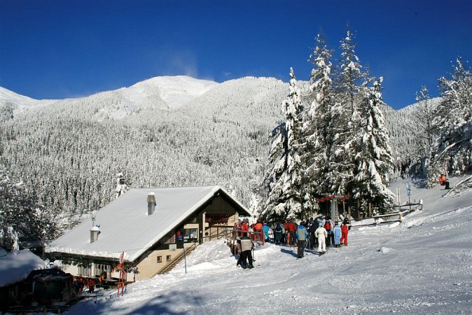 Španov vrh in Slovenia - a group of people standing in the snow.