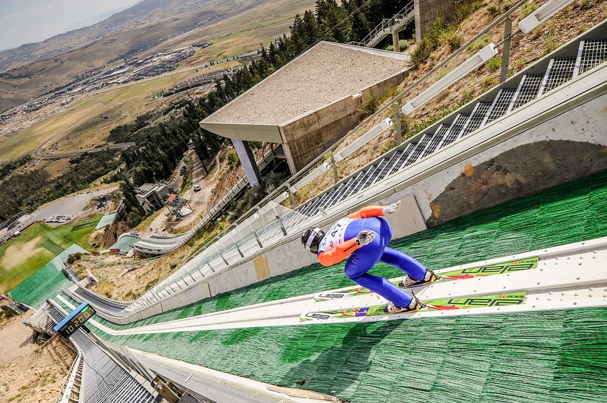 Utah Olympic Park in USA - a skier is going down the side of a slope.
