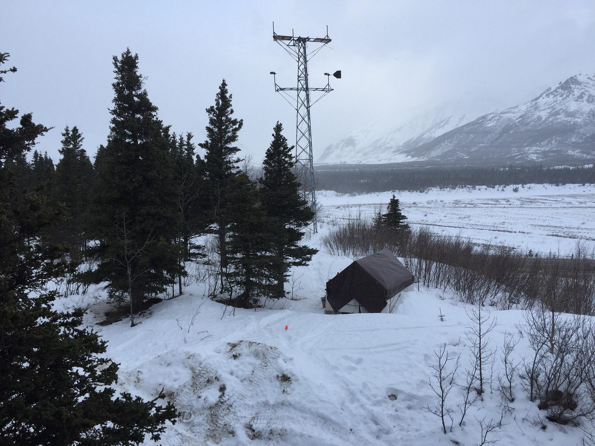 A picturesque winter sports scene in Black Rapid Alaska featuring stunning winter landscapes with snow blanketed terrain commonly associated with a ski resort or winter sports center.