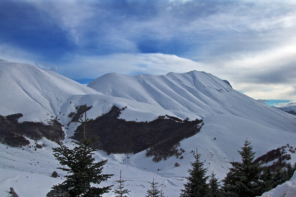 Monte Prata Ski in Italy - blue sky with white clouds.