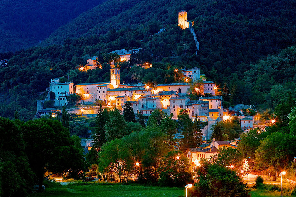 Monte Prata Ski in Italy - a small town lit up at night.
