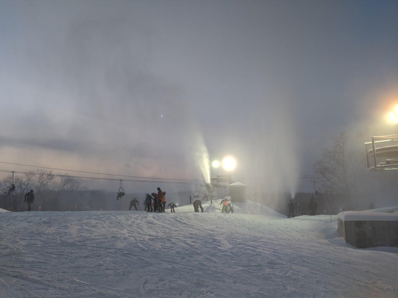 Hidden Valley - MO in USA - a group of people skiing down a snow covered hill.