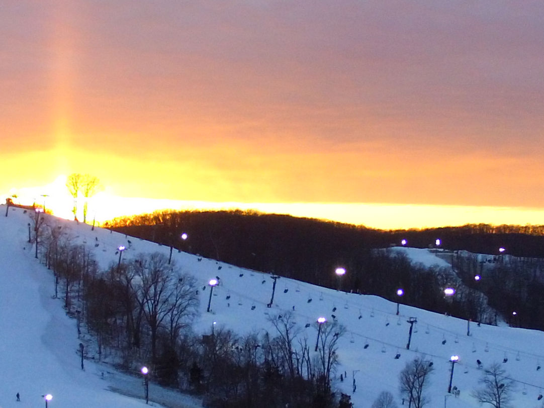 Hidden Valley - MO in USA - the sun is setting over a ski slope.