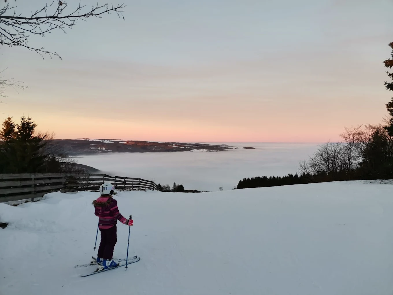 Skilifte Kreuzberg in Germany - a person on skis on a snowy slope.