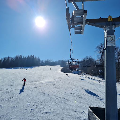 Gače in Slovenia - a person riding a ski board on a snowy slope.