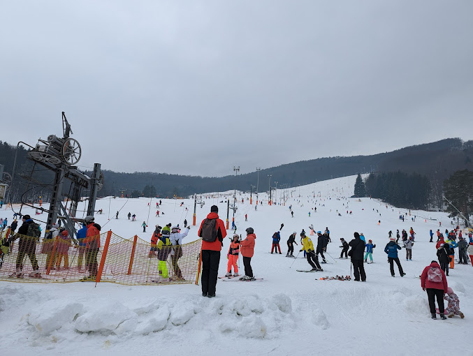 Valčianska Valley in Slovakia - a group of people standing on top of a ski slope.