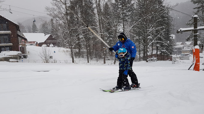 Valčianska Valley in Slovakia - a person on a snowboard in the snow.