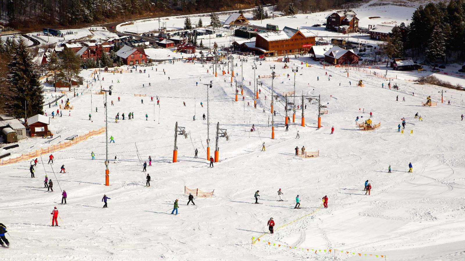 Valčianska Valley in Slovakia - a group of people skiing down a hill.