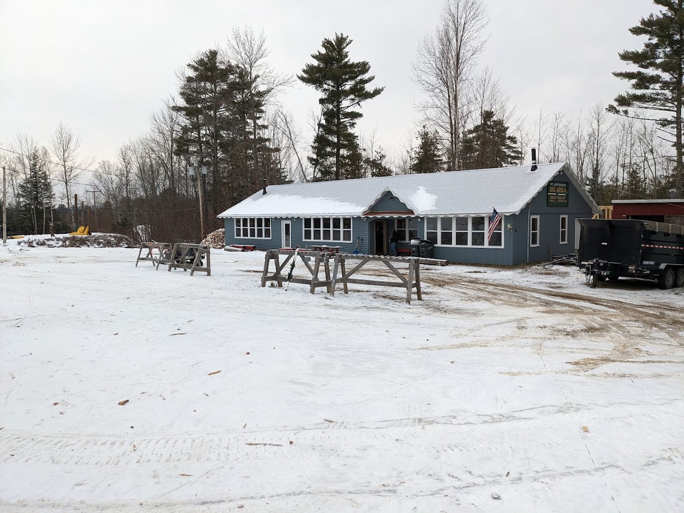 Mt. Jefferson in USA - a blue house with snow on the ground.