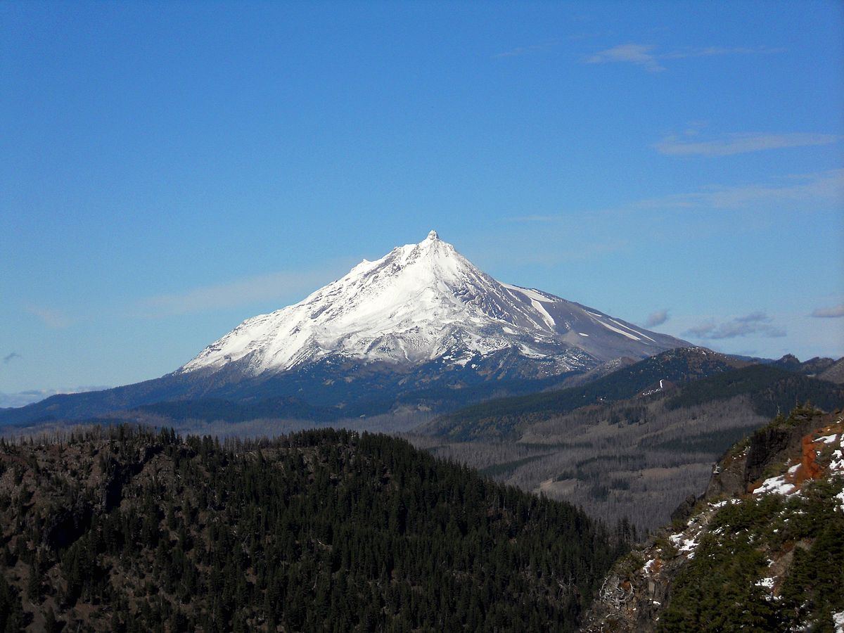 Mt. Jefferson in USA - a mountain with a snow covered peak in the background.