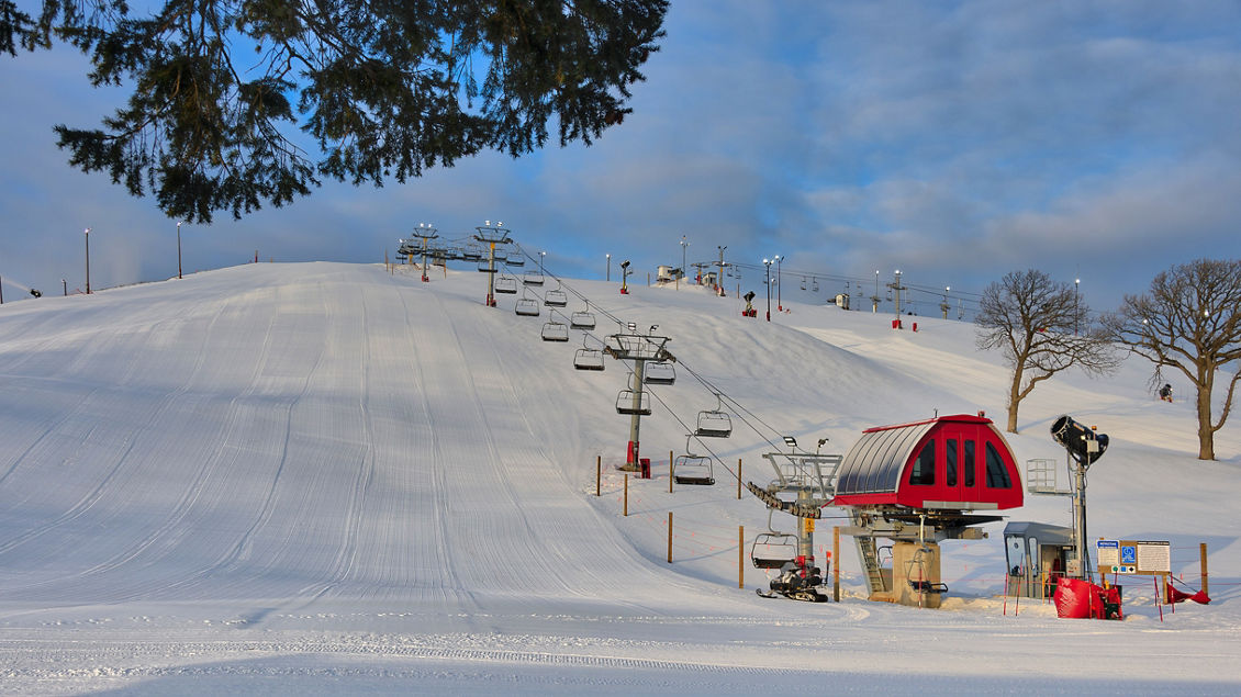 Wilmot Mountain in USA - a ski lift going up a snowy hill.