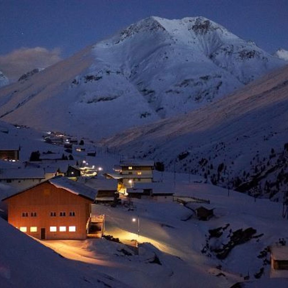 Avers in Switzerland - a snow covered mountain at night in the swiss alps.