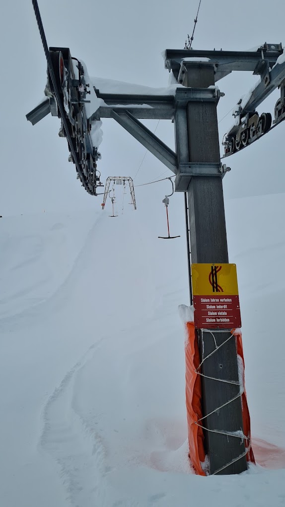 Avers in Switzerland - a ski lift in the middle of a snowy mountain.