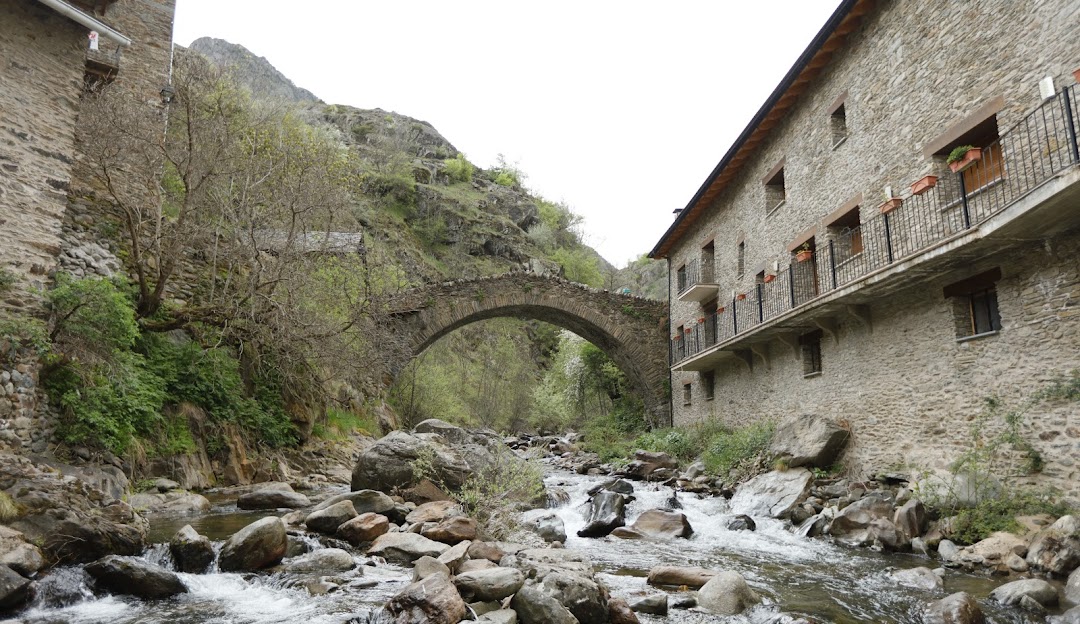 Pleta del Prat – Tavascan in Spain - a river runs through a small village in the mountains.