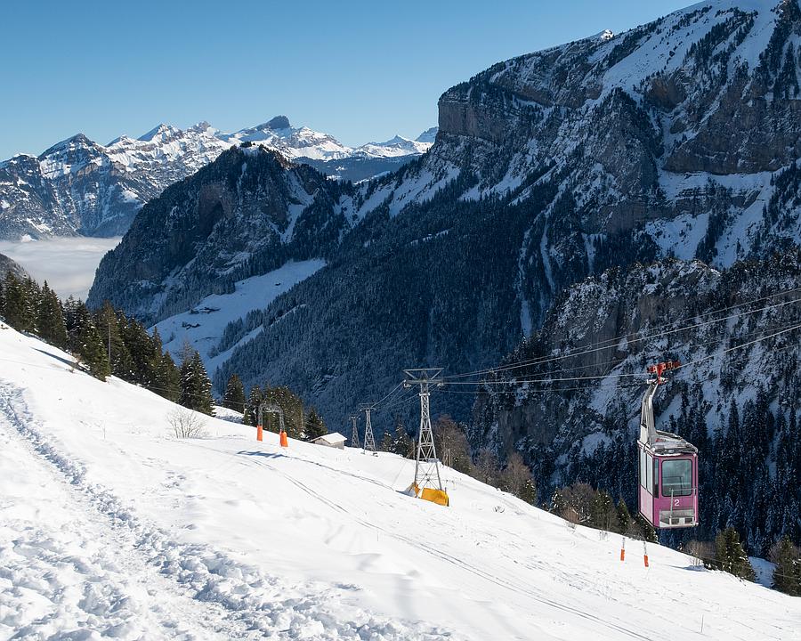Gitschenen in Switzerland - a ski slope with a ski lift going down it.